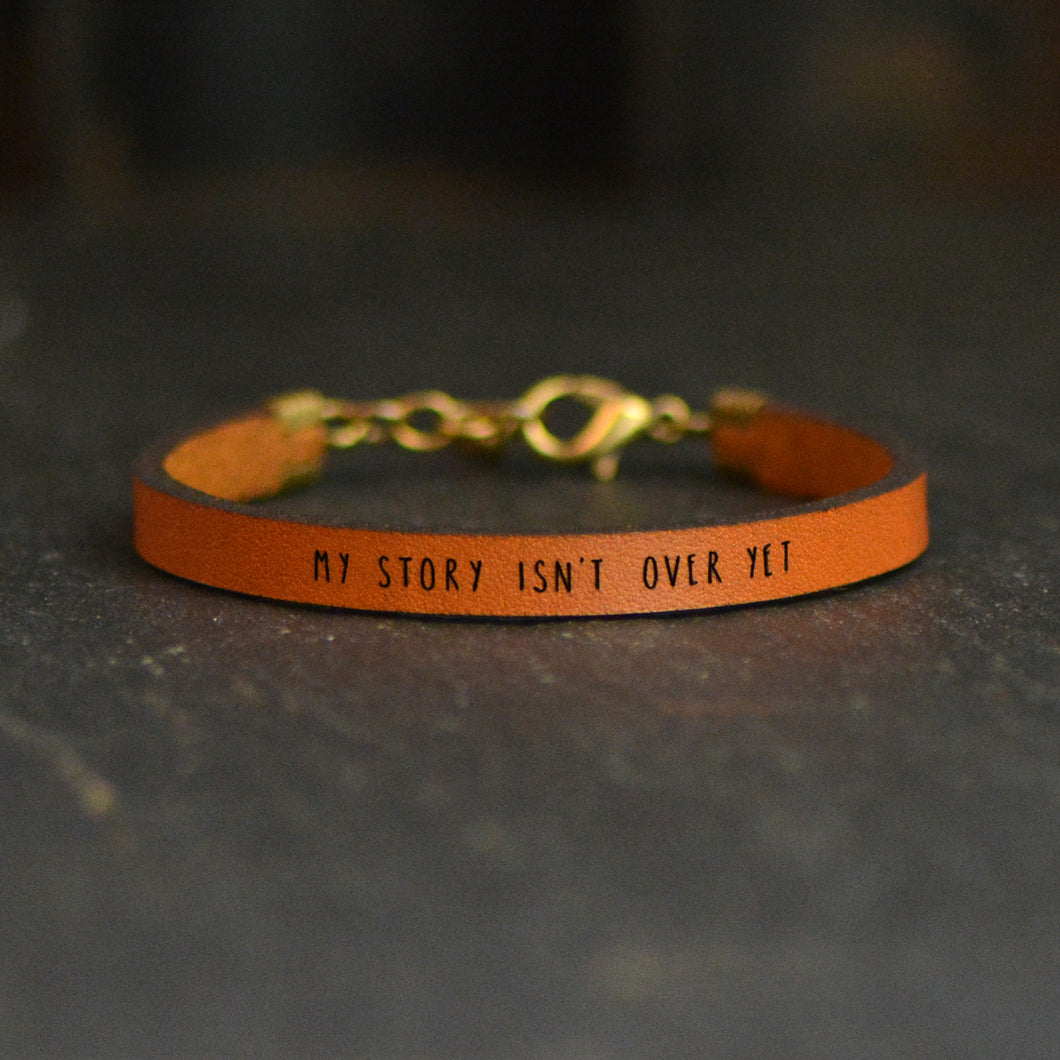 MY STORY ISN'T OVER Engraved Leather Bracelet