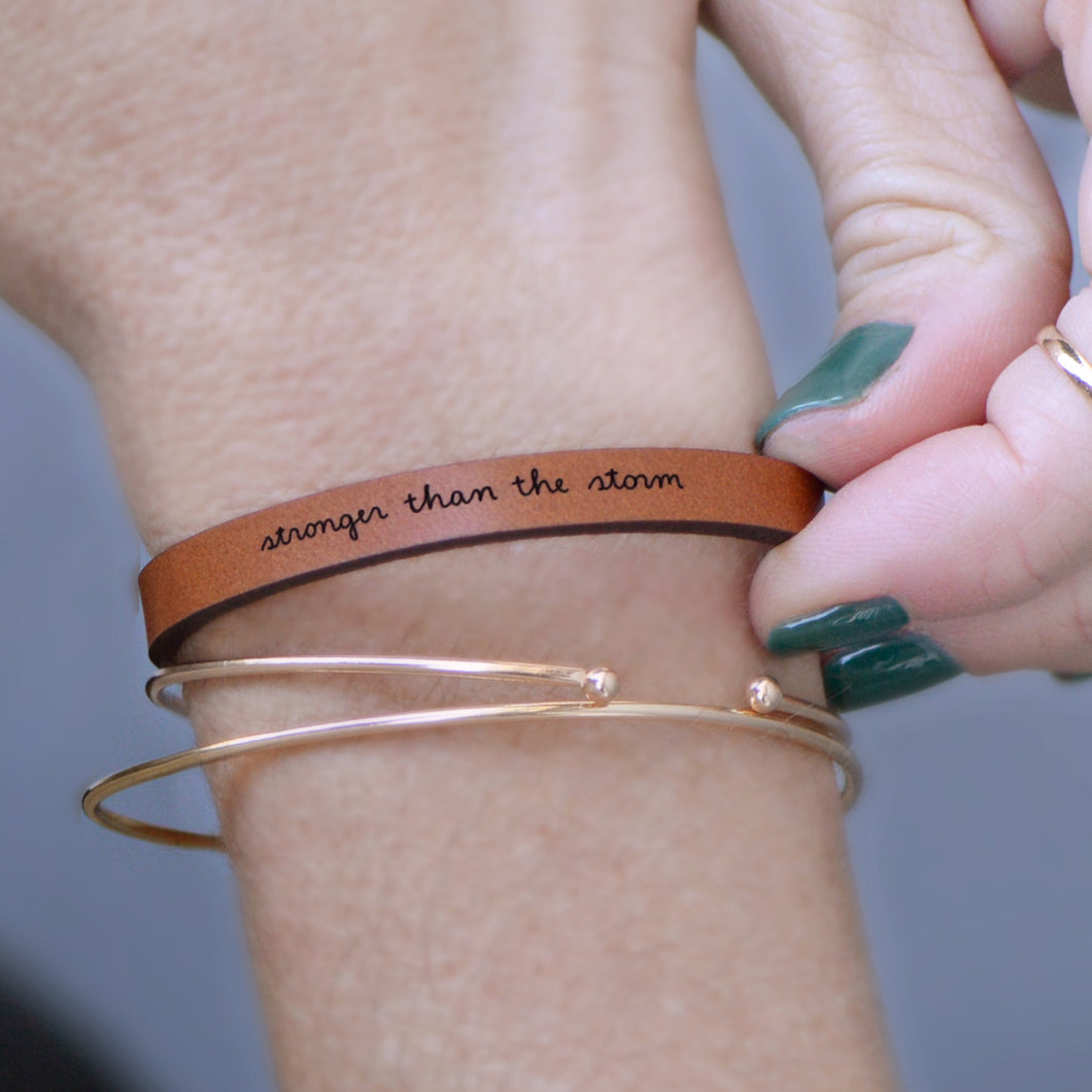 stronger than the storm  Engraved Leather Bracelet